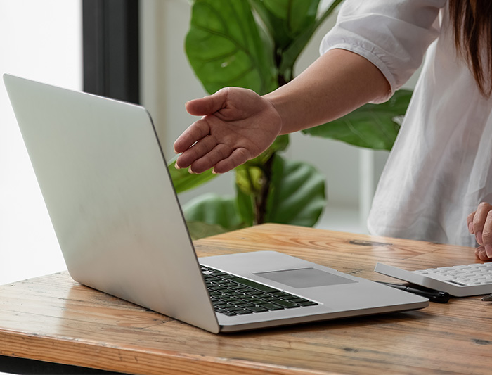 Women Pointing to Computer